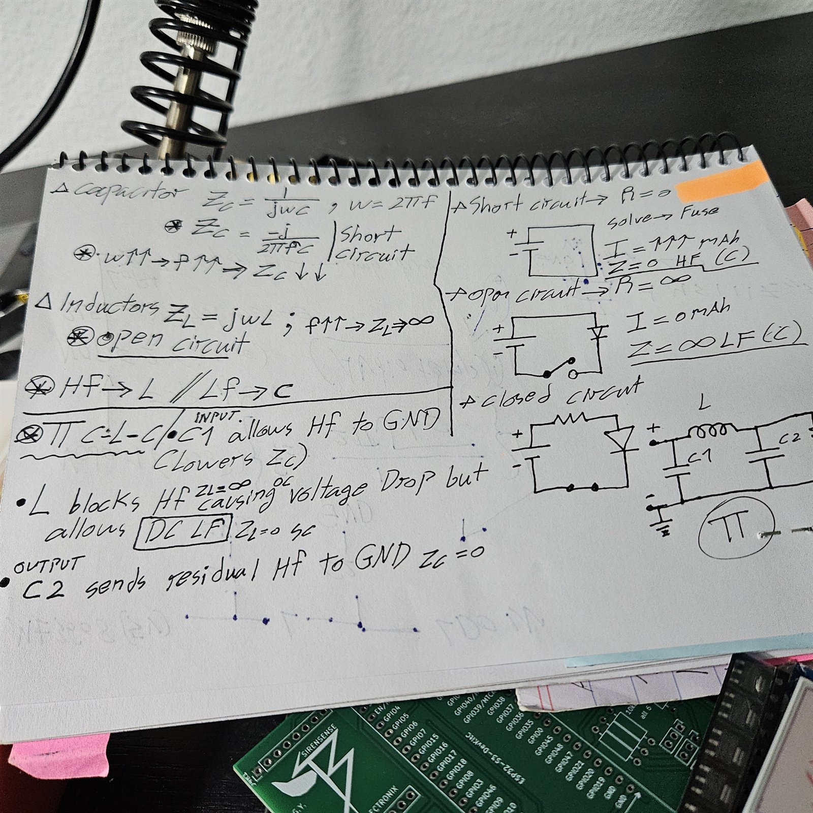 A page of handwritten engineering notes on capacitor and inductor impedance, with circuit sketches and a pi filter