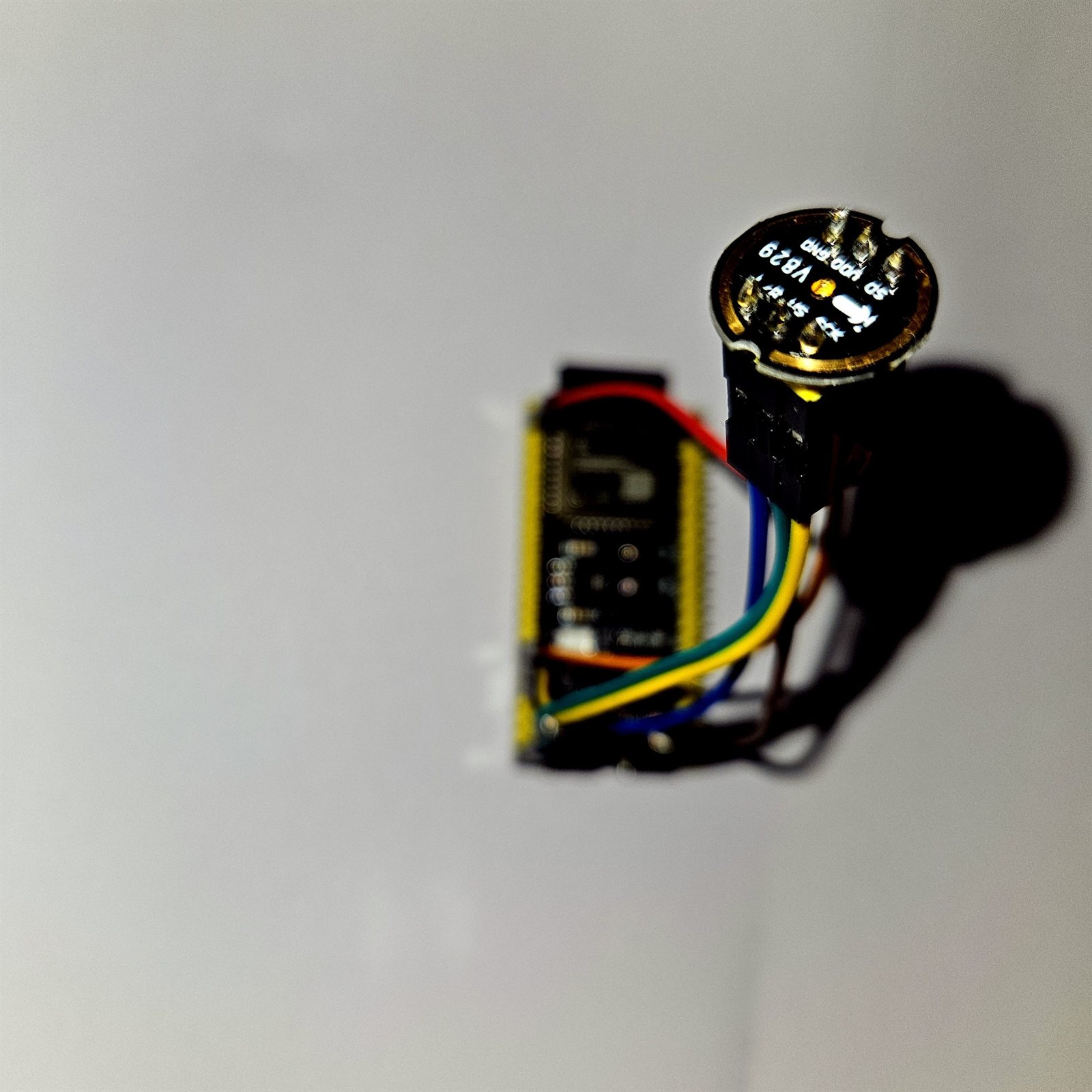 Macro photograph of a lithium battery holder and small module with wires attached