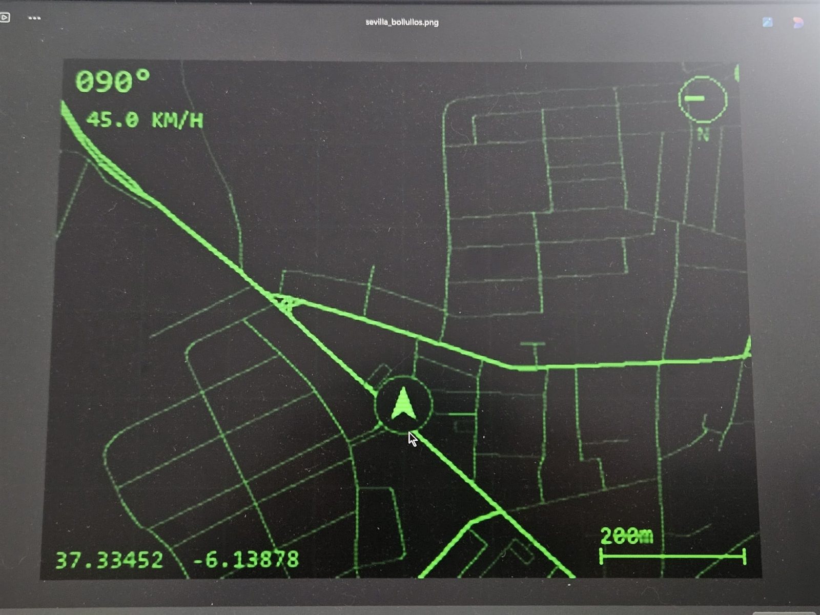 A dark screen showing a green vector map with a heading of 090 degrees, 45 kilometres per hour and coordinates